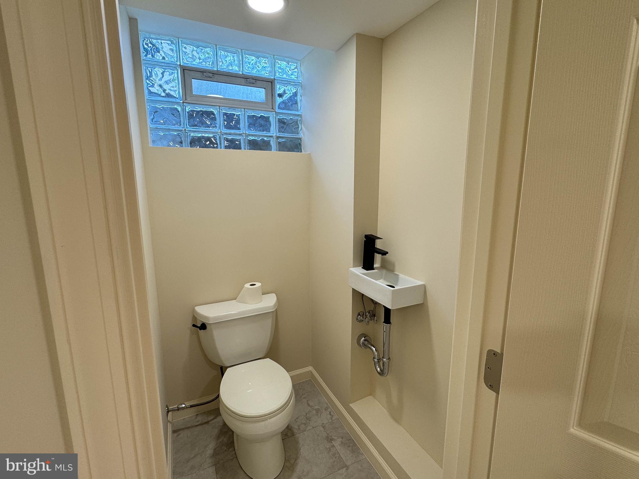 9421 Thornhill Road Silver Spring, MD 20901 - Photo 35 of 42 powder room -lower level