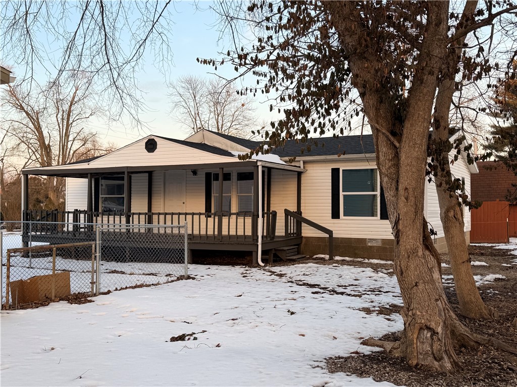 307 West 7th Street St. Elmo, IL 62458 - Photo 5 of 17 a front view of a house with a yard covered with snow