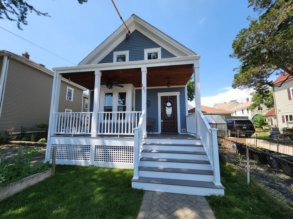122 Walnut Street Boston, MA 02122 - Photo 2 of 17 a view of a house with backyard and porch