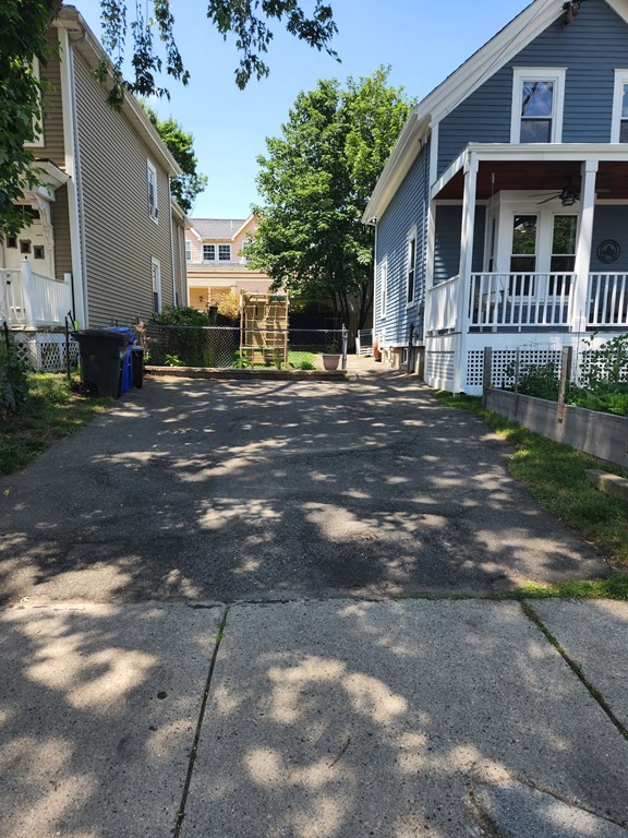 122 Walnut Street Boston, MA 02122 - Photo 5 of 17 a front view of a house with a yard