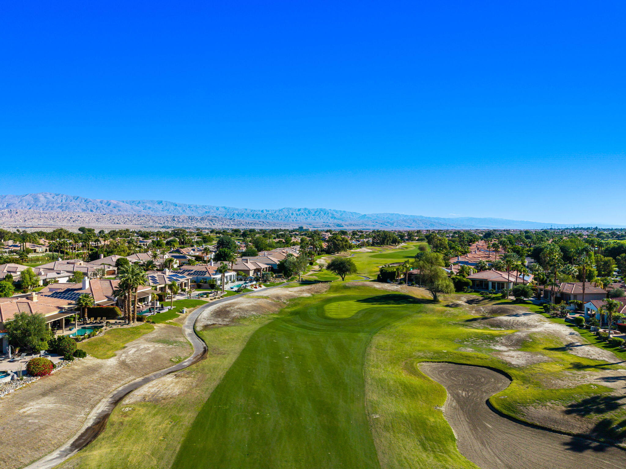 96 Vía Bella Rancho Mirage, CA 92270 - Photo 12 of 60 a view of a swimming pool and lake view