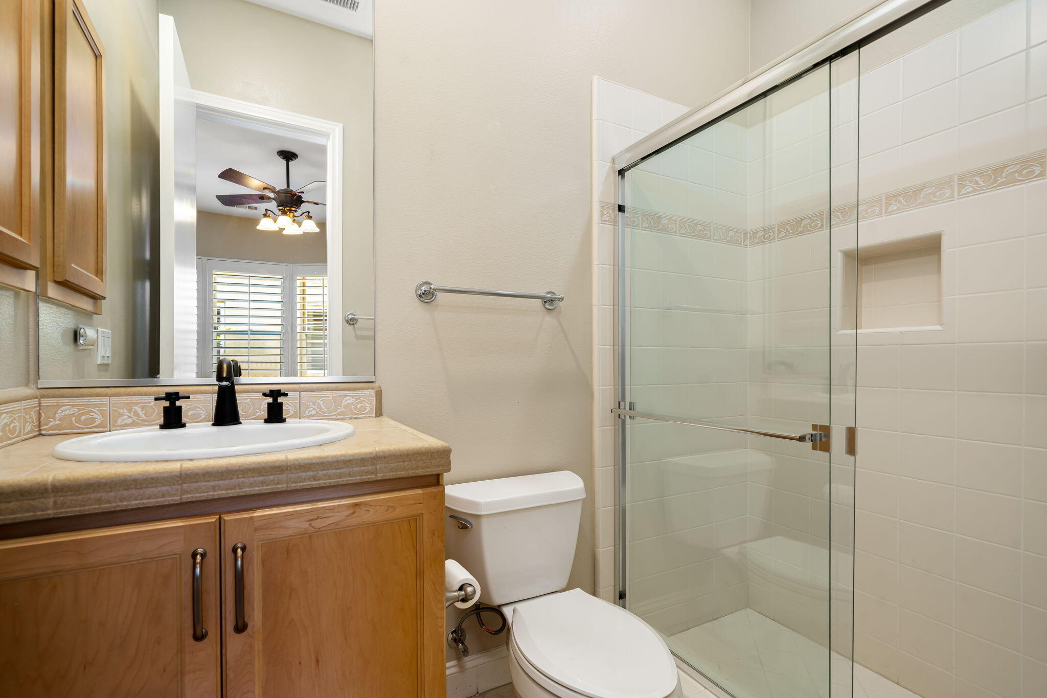 96 Vía Bella Rancho Mirage, CA 92270 - Photo 13 of 60 a bathroom with a sink a toilet and a mirror