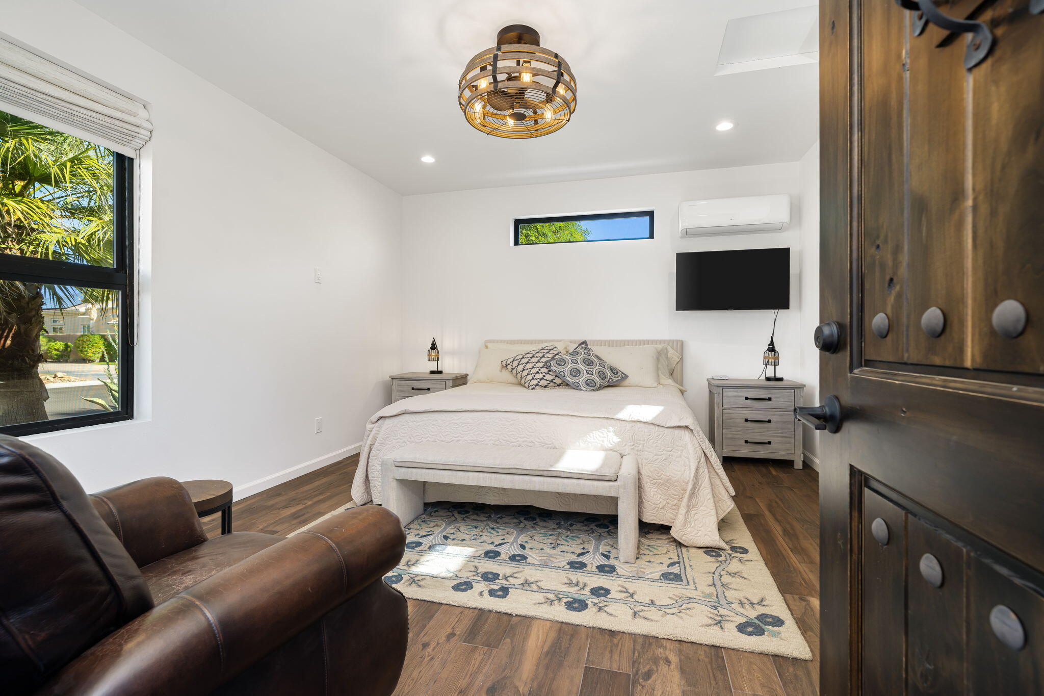 96 Vía Bella Rancho Mirage, CA 92270 - Photo 15 of 60 a living room with a bed furniture and a window
