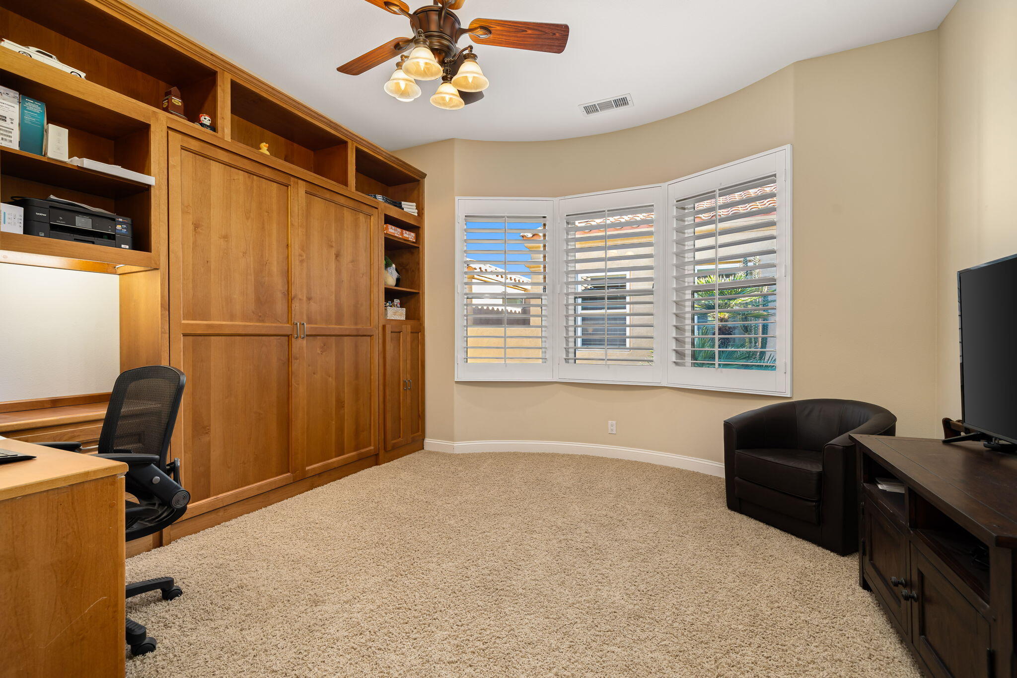 96 Vía Bella Rancho Mirage, CA 92270 - Photo 24 of 60 a livingroom with workspace window and a couch