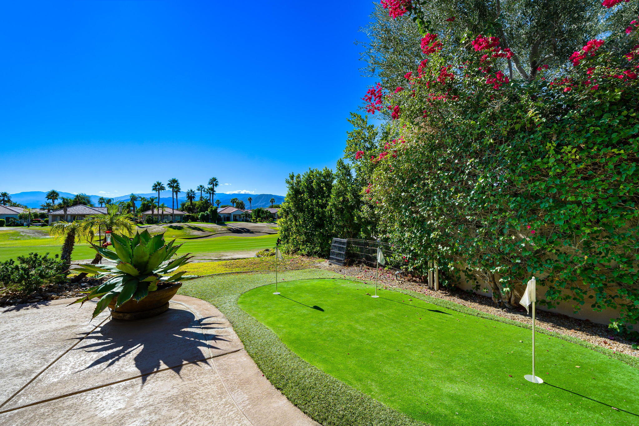 96 Vía Bella Rancho Mirage, CA 92270 - Photo 28 of 60 a view of a garden with a flower in a garden