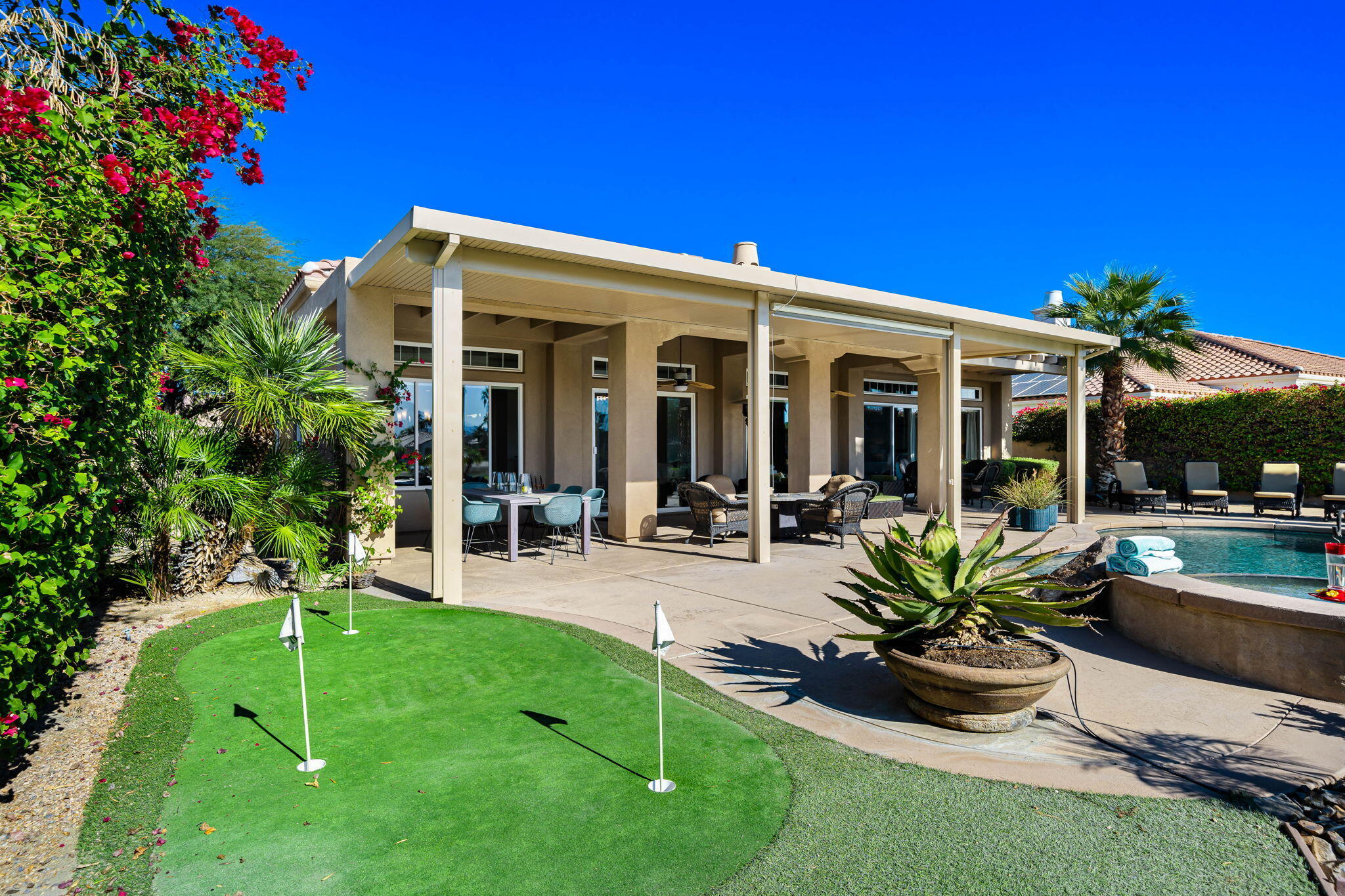 96 Vía Bella Rancho Mirage, CA 92270 - Photo 29 of 60 a view of a house with backyard porch and sitting area