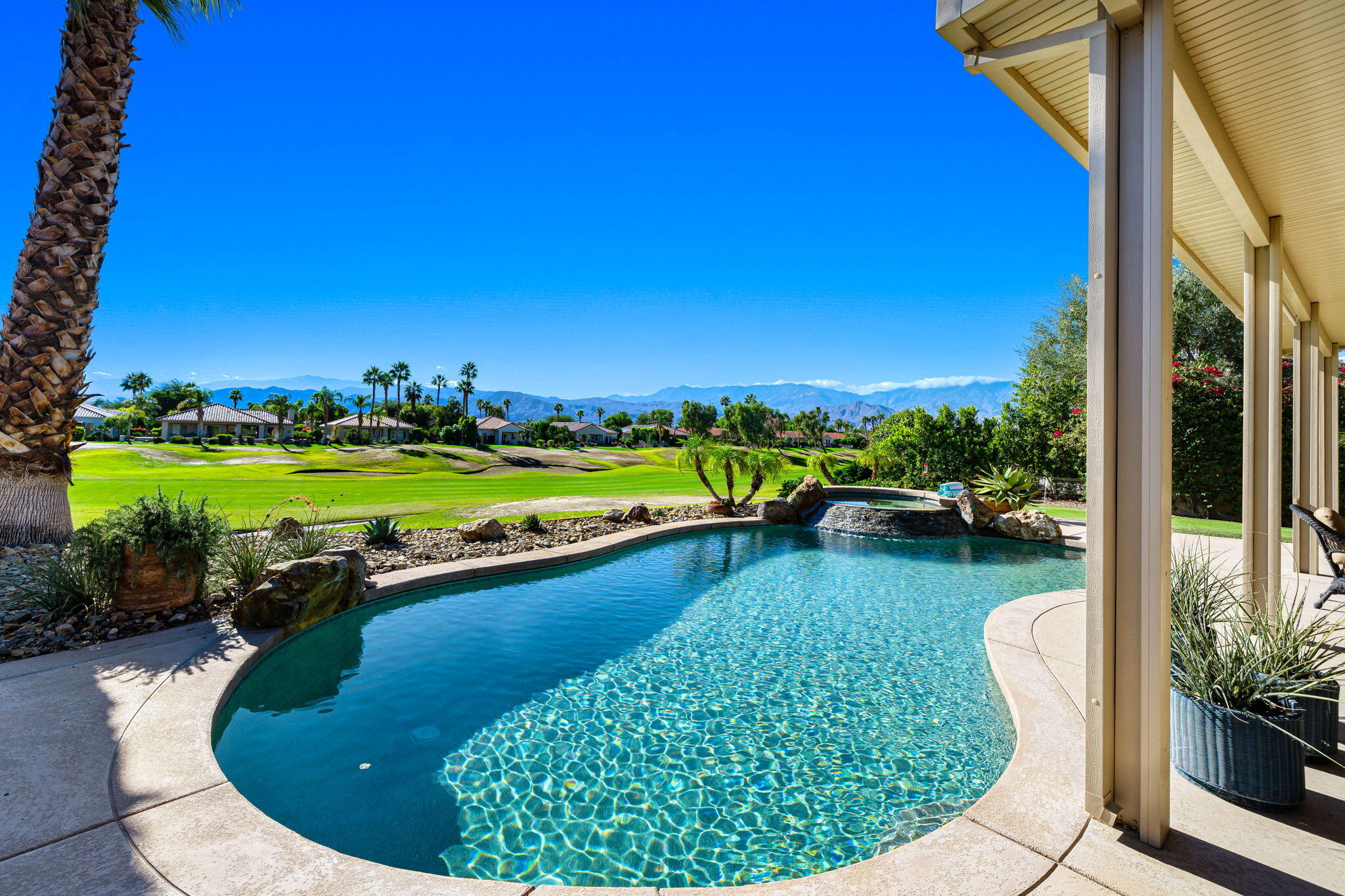 96 Vía Bella Rancho Mirage, CA 92270 - Photo 31 of 60 a view of a swimming pool and lounge chair