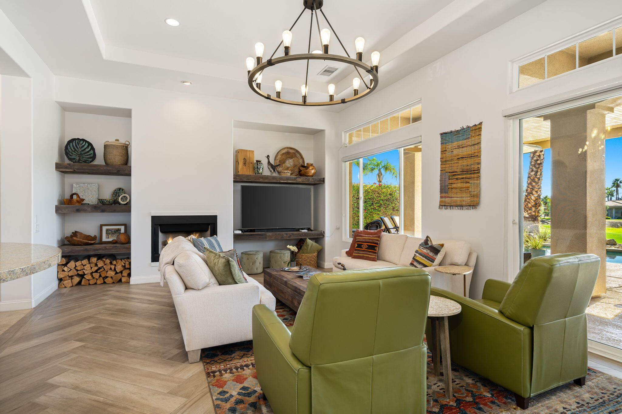 96 Vía Bella Rancho Mirage, CA 92270 - Photo 44 of 60 a living room with furniture a chandelier and a flat screen tv