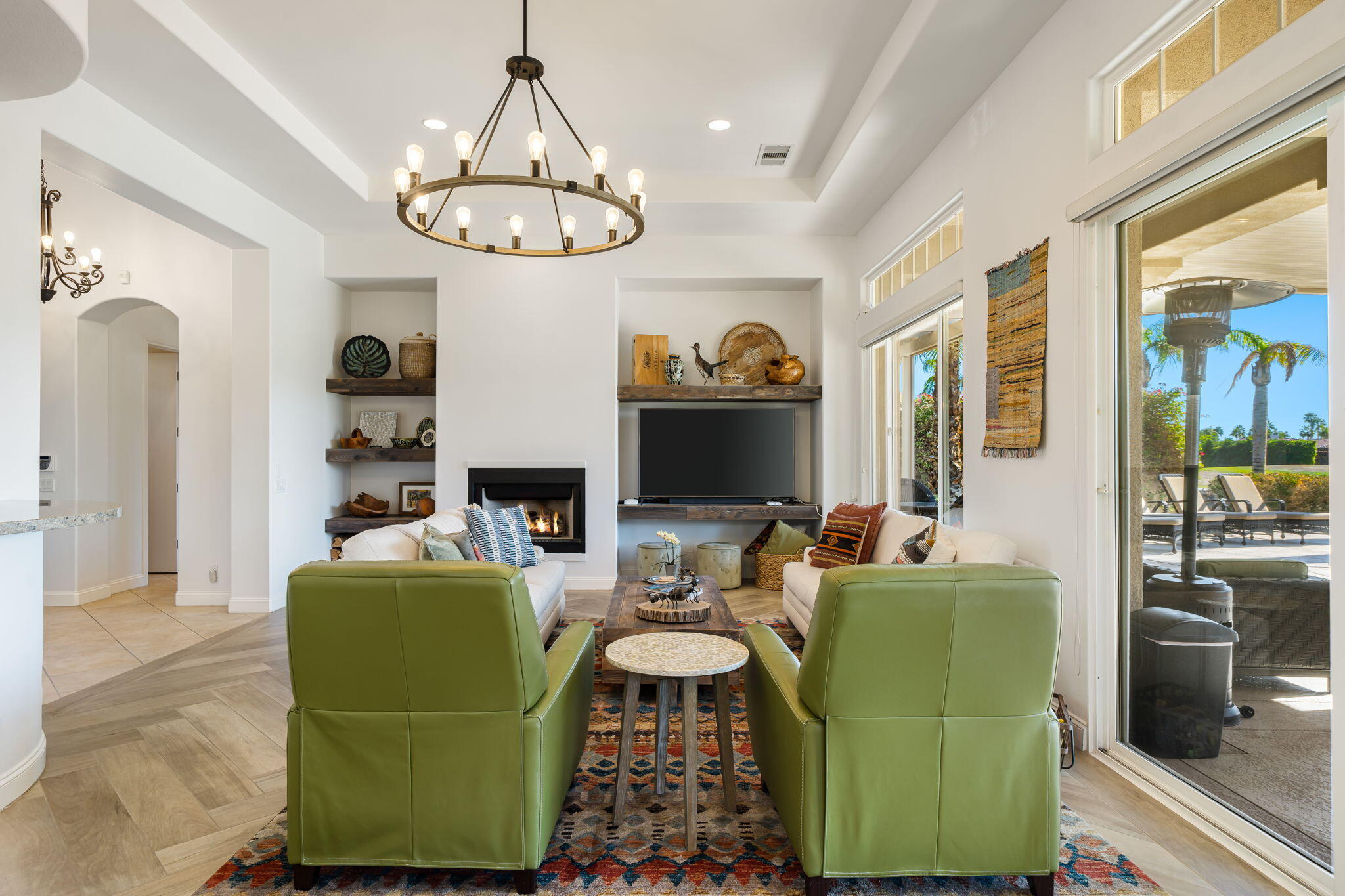 96 Vía Bella Rancho Mirage, CA 92270 - Photo 45 of 60 a living room with furniture a fireplace and a flat screen tv