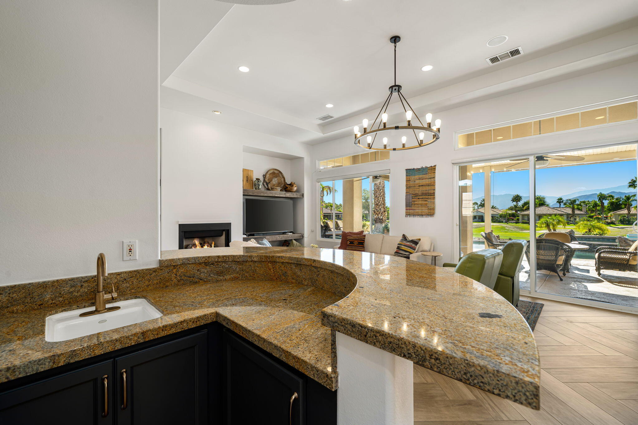 96 Vía Bella Rancho Mirage, CA 92270 - Photo 48 of 60 a kitchen with granite countertop a sink and a stove