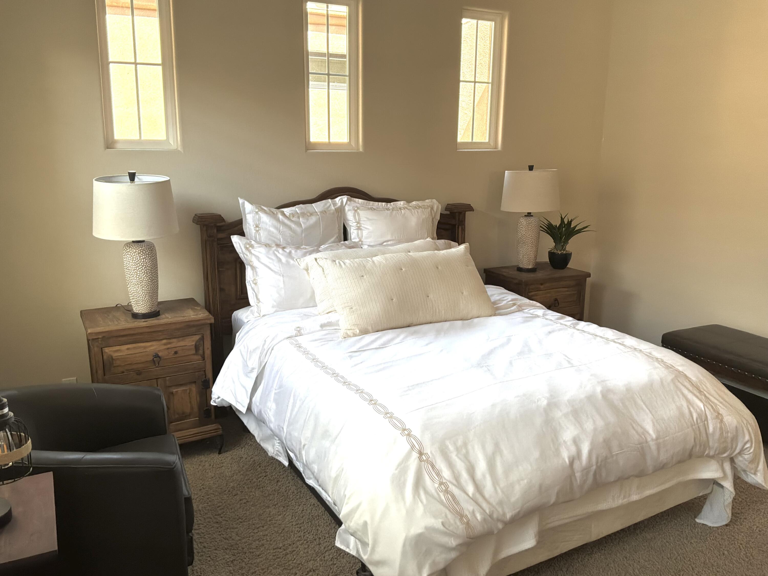 96 Vía Bella Rancho Mirage, CA 92270 - Photo 60 of 60 a large bed sitting in a bedroom next to a window