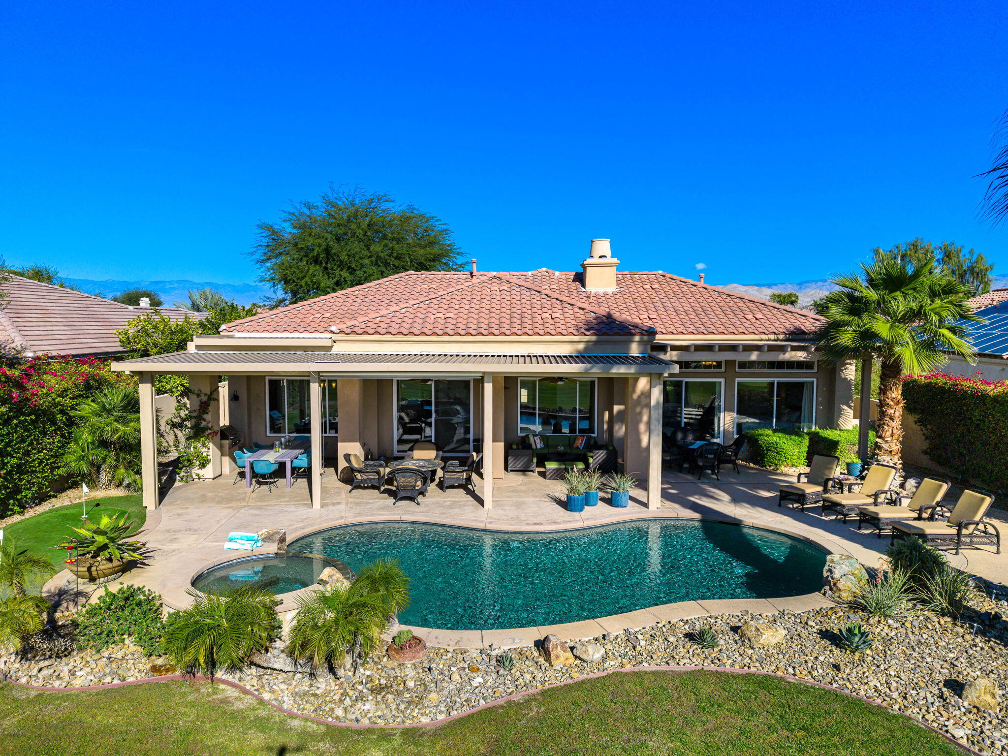 96 Vía Bella Rancho Mirage, CA 92270 - Photo 9 of 60 a view of a house with backyard outdoor seating area and furniture