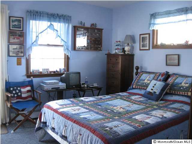59 Spray Way Lavallette, NJ 08735 - Photo 7 of 7 a bedroom with a bed and a window