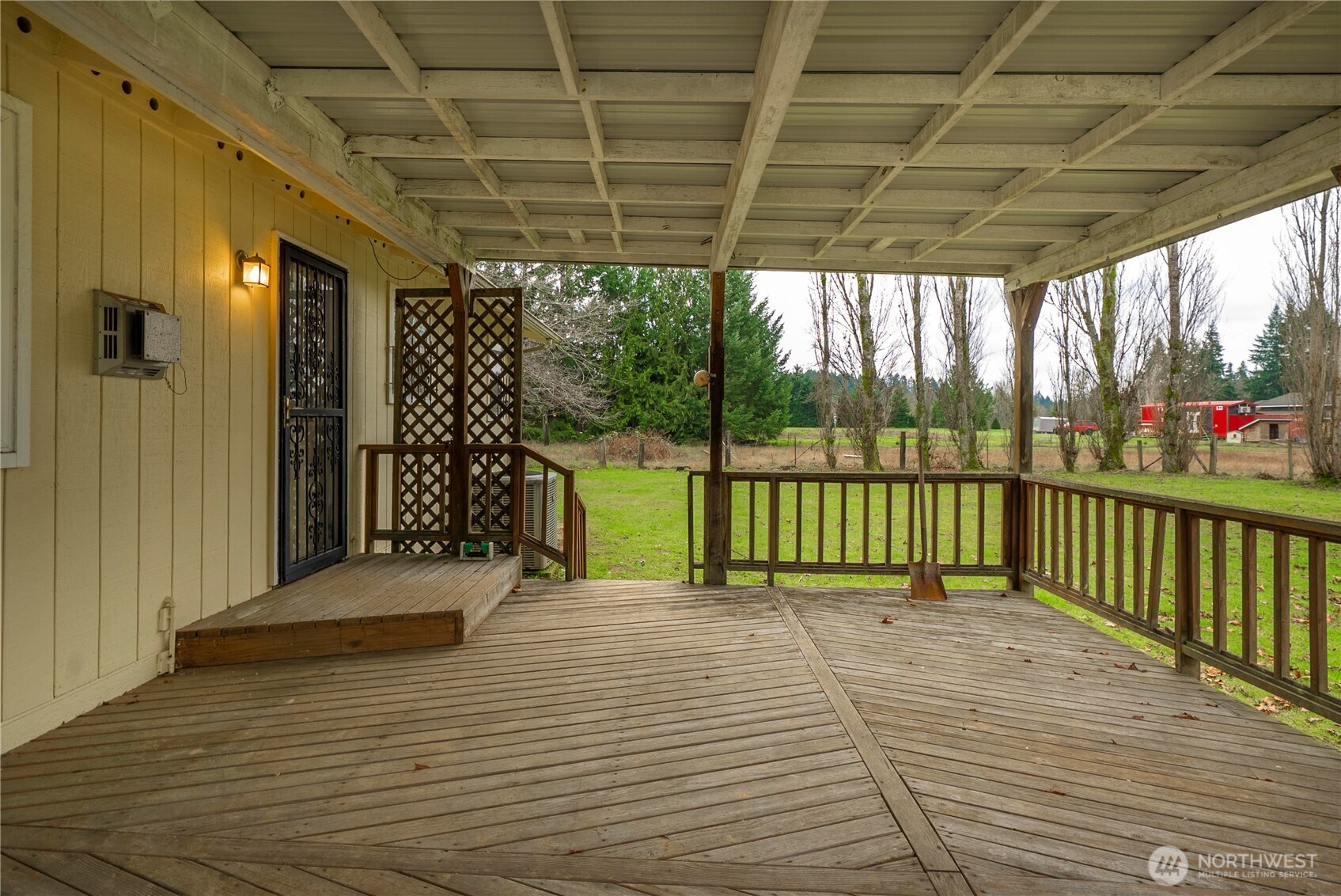 9405 Rich Road Southeast Olympia, WA 98501 - Photo 17 of 25 a view of a porch with wooden floor and outdoor space