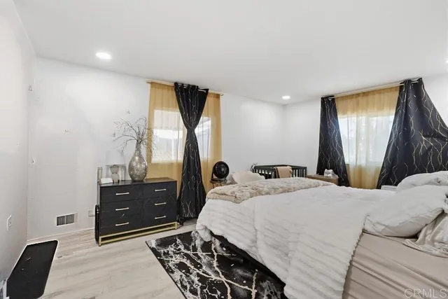 a bed room with a bed and a window