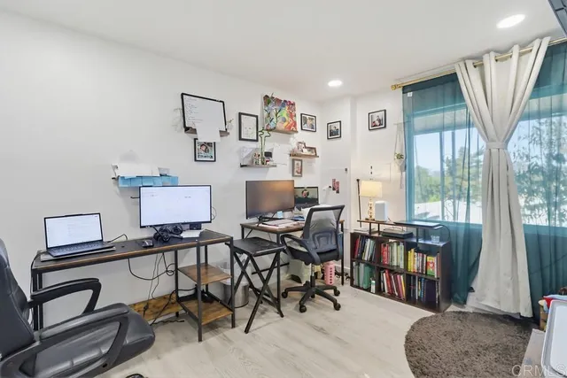 a view of a livingroom with furniture and a window