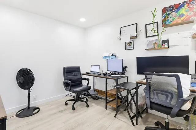 a view of a workspace with furniture