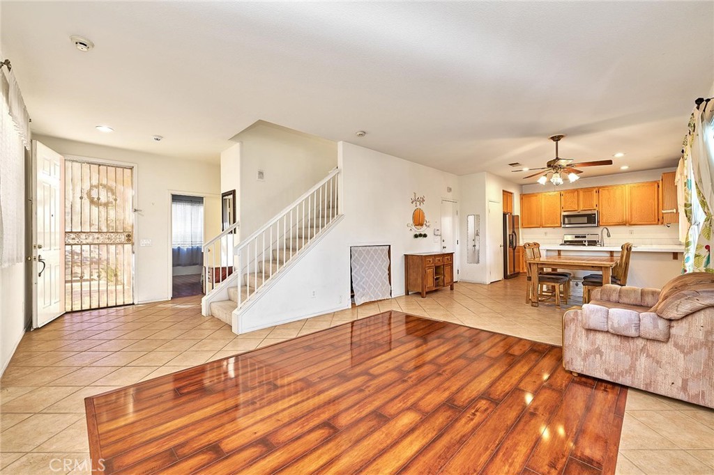 7371 Correspondence Place Rancho Cucamonga, CA 91730 - Photo 12 of 39 a living room with furniture and a wooden floor