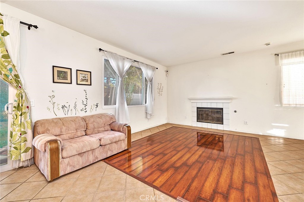 7371 Correspondence Place Rancho Cucamonga, CA 91730 - Photo 14 of 39 a living room with furniture and a fireplace