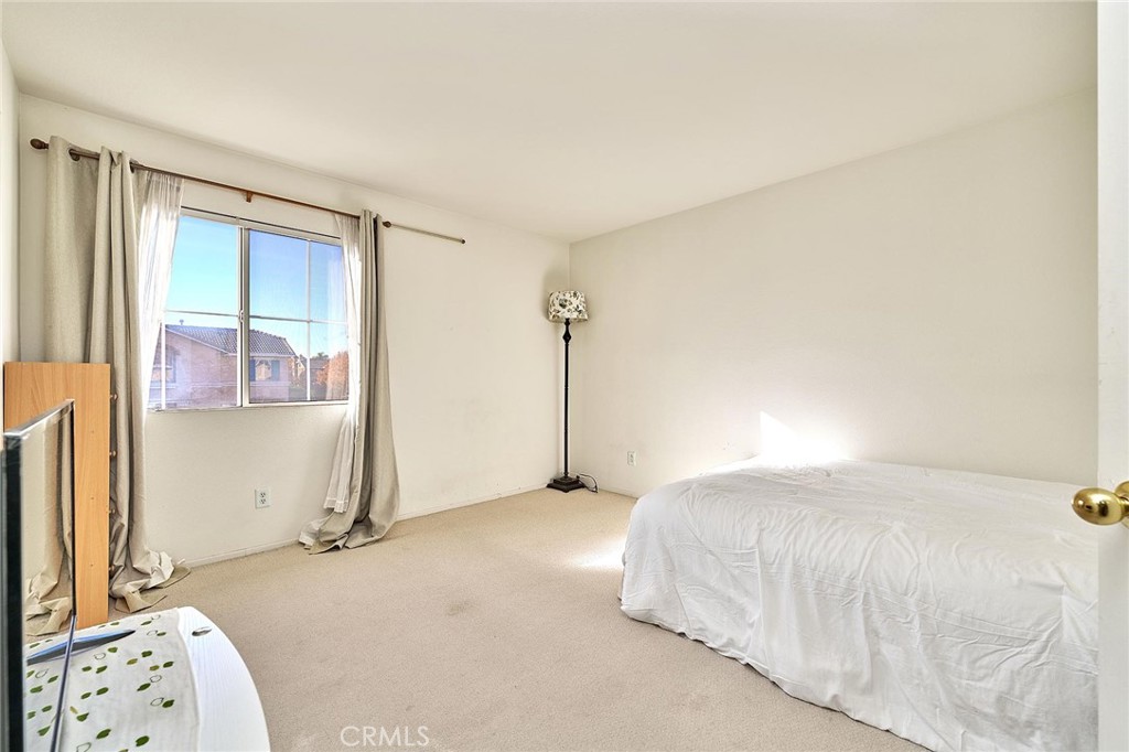 7371 Correspondence Place Rancho Cucamonga, CA 91730 - Photo 24 of 39 a bedroom with a bed and a window