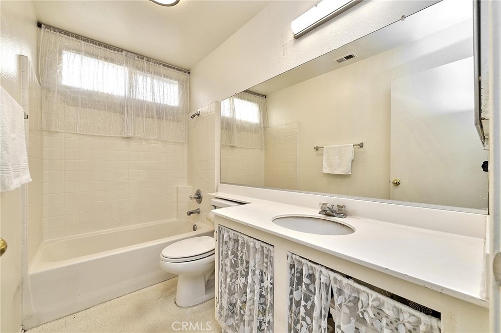 7371 Correspondence Place Rancho Cucamonga, CA 91730 - Photo 25 of 39 a bathroom with a sink a toilet and a bathtub