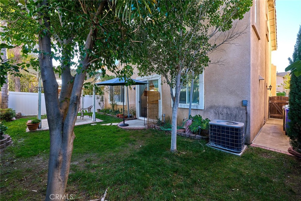 7371 Correspondence Place Rancho Cucamonga, CA 91730 - Photo 32 of 39 a view of a house with backyard and a tree