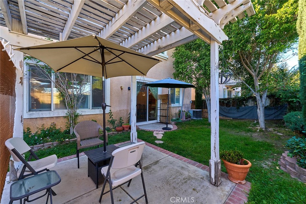 7371 Correspondence Place Rancho Cucamonga, CA 91730 - Photo 33 of 39 a view of a chair and table in backyard of the house