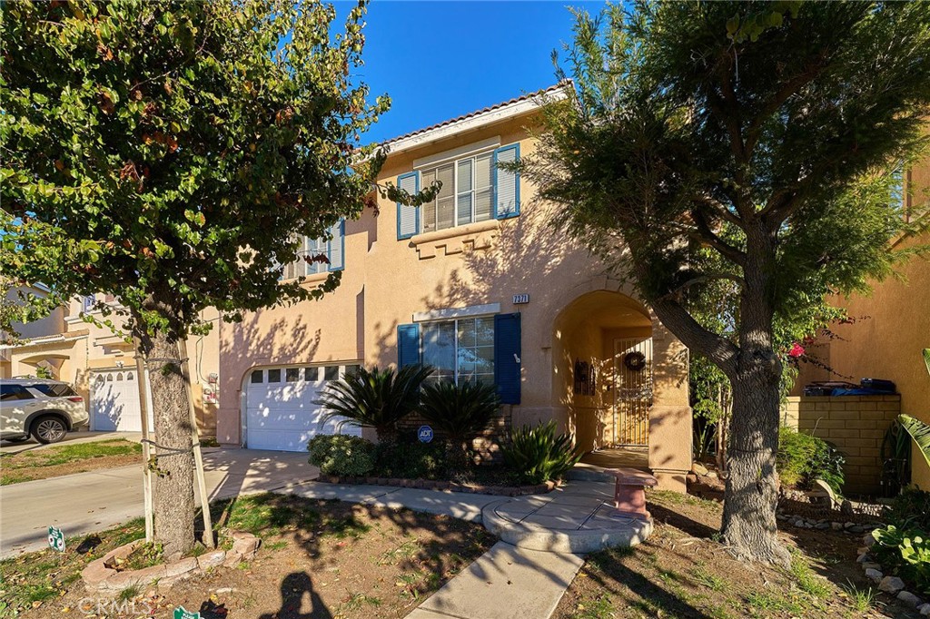 7371 Correspondence Place Rancho Cucamonga, CA 91730 - Photo 36 of 39 a view of a house with a yard