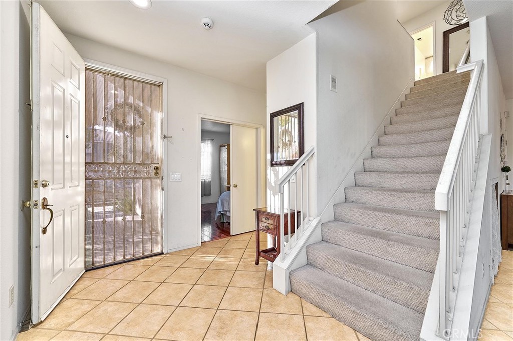7371 Correspondence Place Rancho Cucamonga, CA 91730 - Photo 7 of 39 a view of a hallway with windows and entryway
