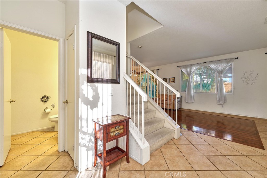 7371 Correspondence Place Rancho Cucamonga, CA 91730 - Photo 10 of 39 a view of an entryway with wooden floor and door