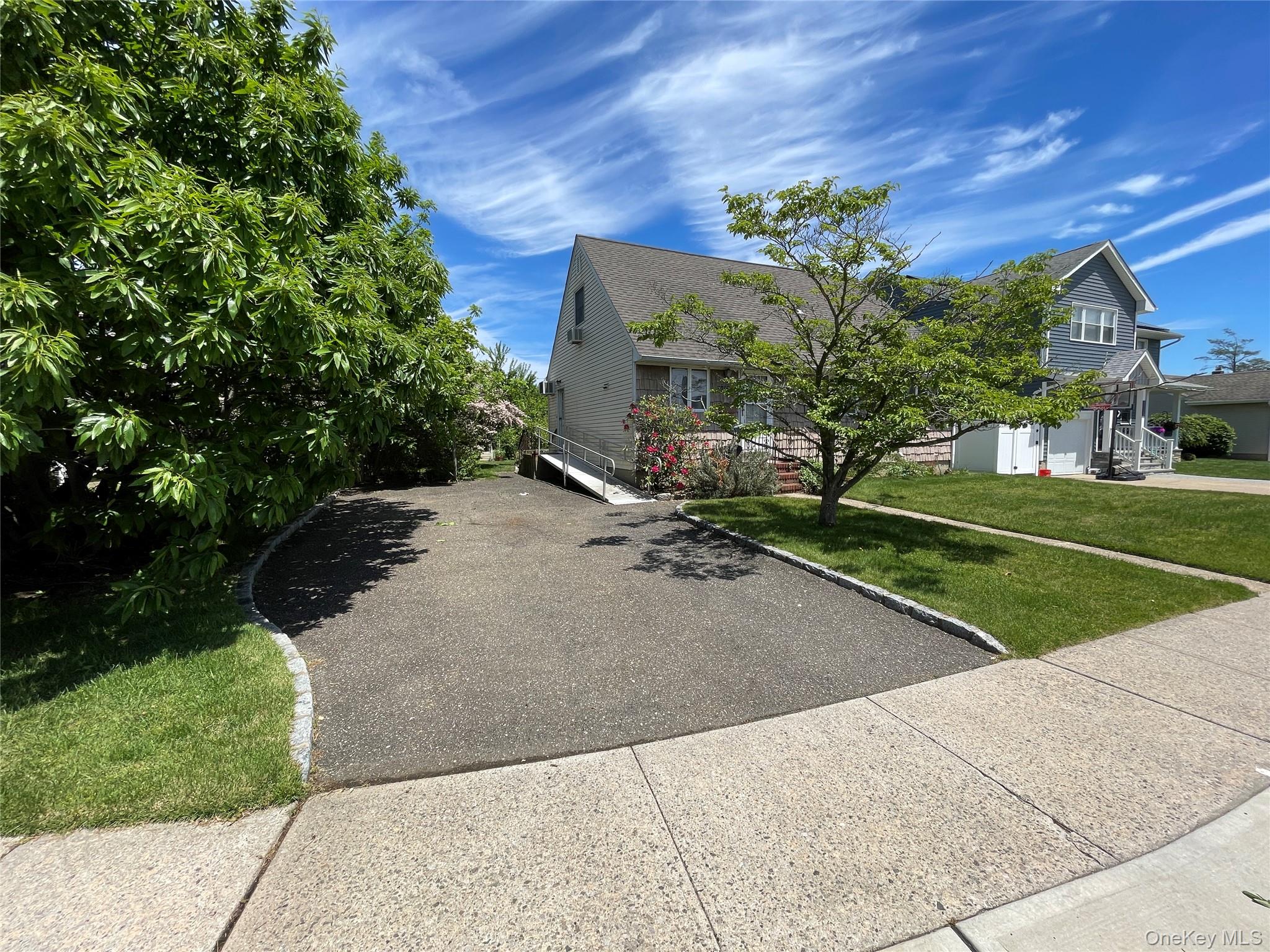 2043 Paddock Road Seaford, NY 11783 - Photo 23 of 25 a view of a backyard