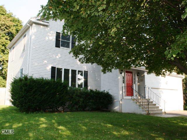 1790 Stratfield Road Fairfield, CT 06825 - Photo 1 of 1 a front view of house with a garden