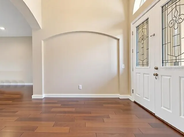 a kitchen with stainless steel appliances granite countertop a sink dishwasher stove and cabinets