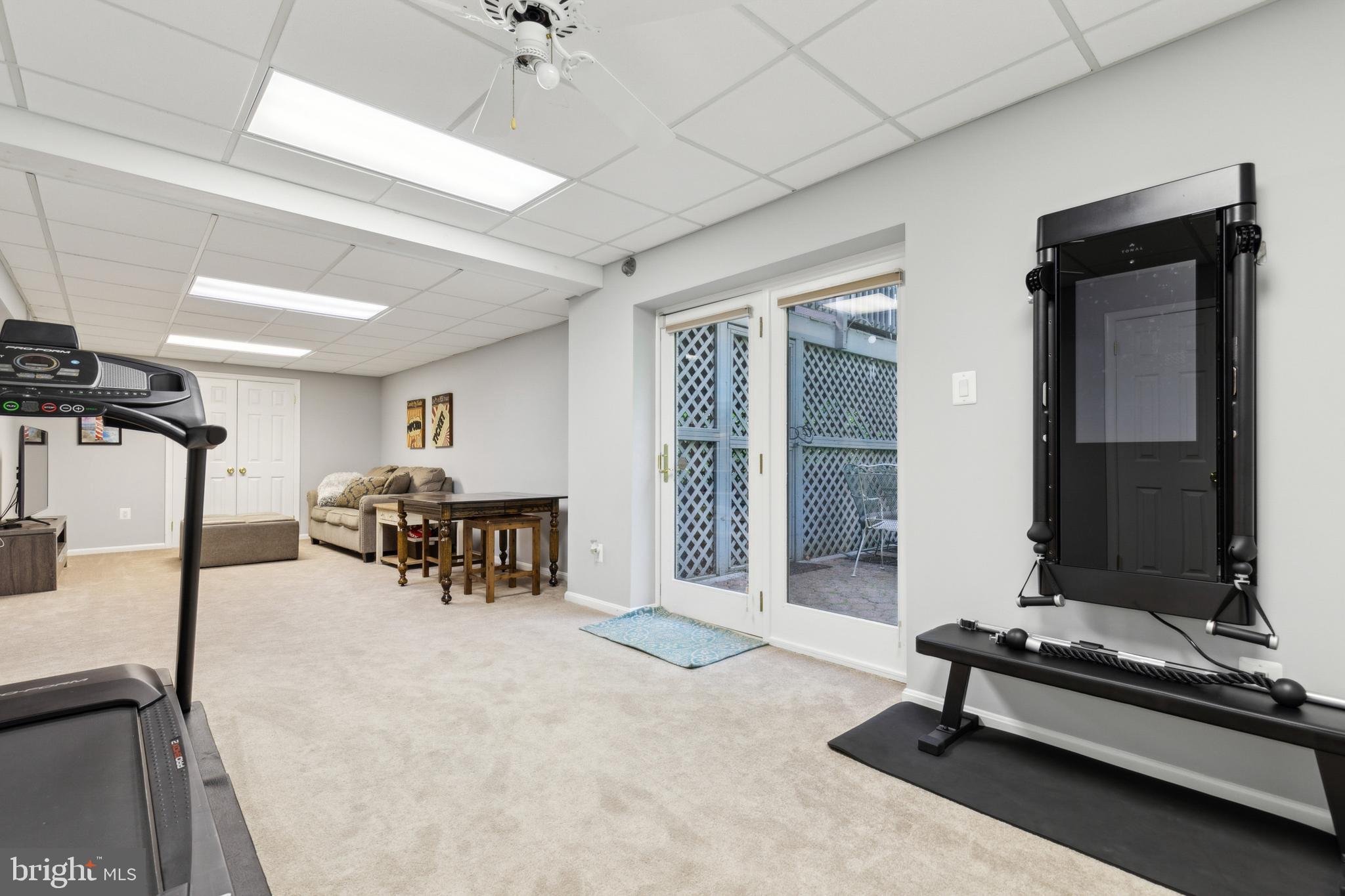 6724 Passageway Place Burke, VA 22015 - Photo 19 of 26 a living room with furniture a table and chairs