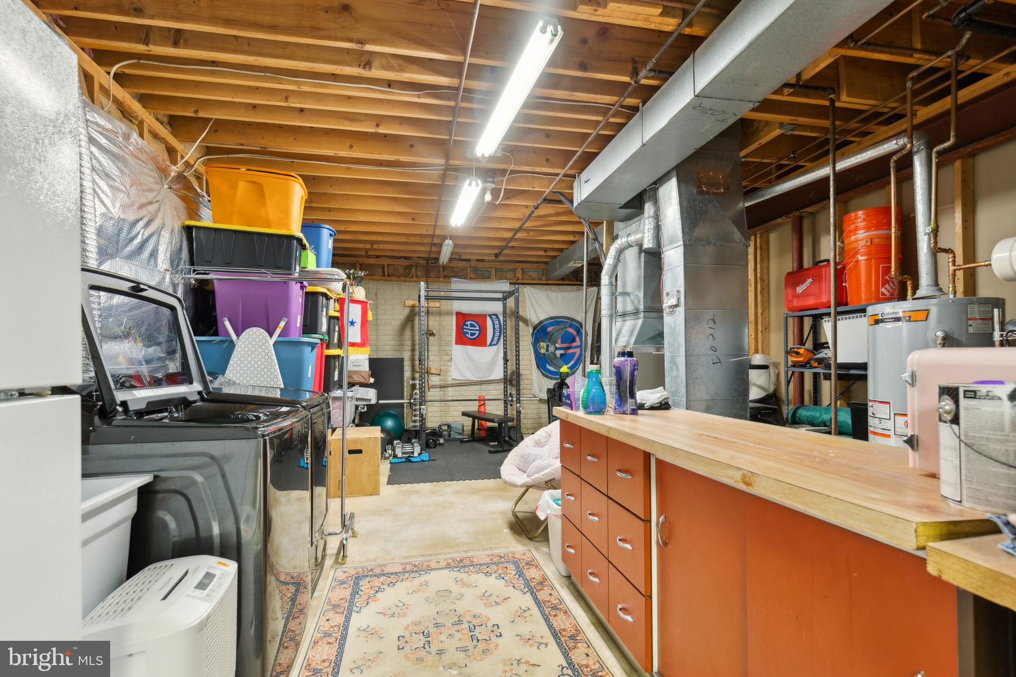 6724 Passageway Place Burke, VA 22015 - Photo 22 of 26 a utility room with sink dryer and washer