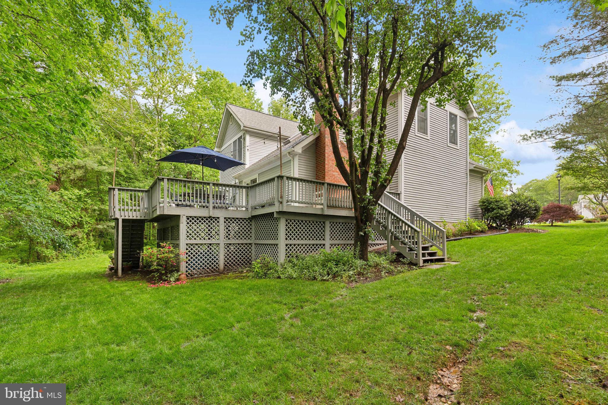 6724 Passageway Place Burke, VA 22015 - Photo 24 of 26 a view of a house with backyard and garden