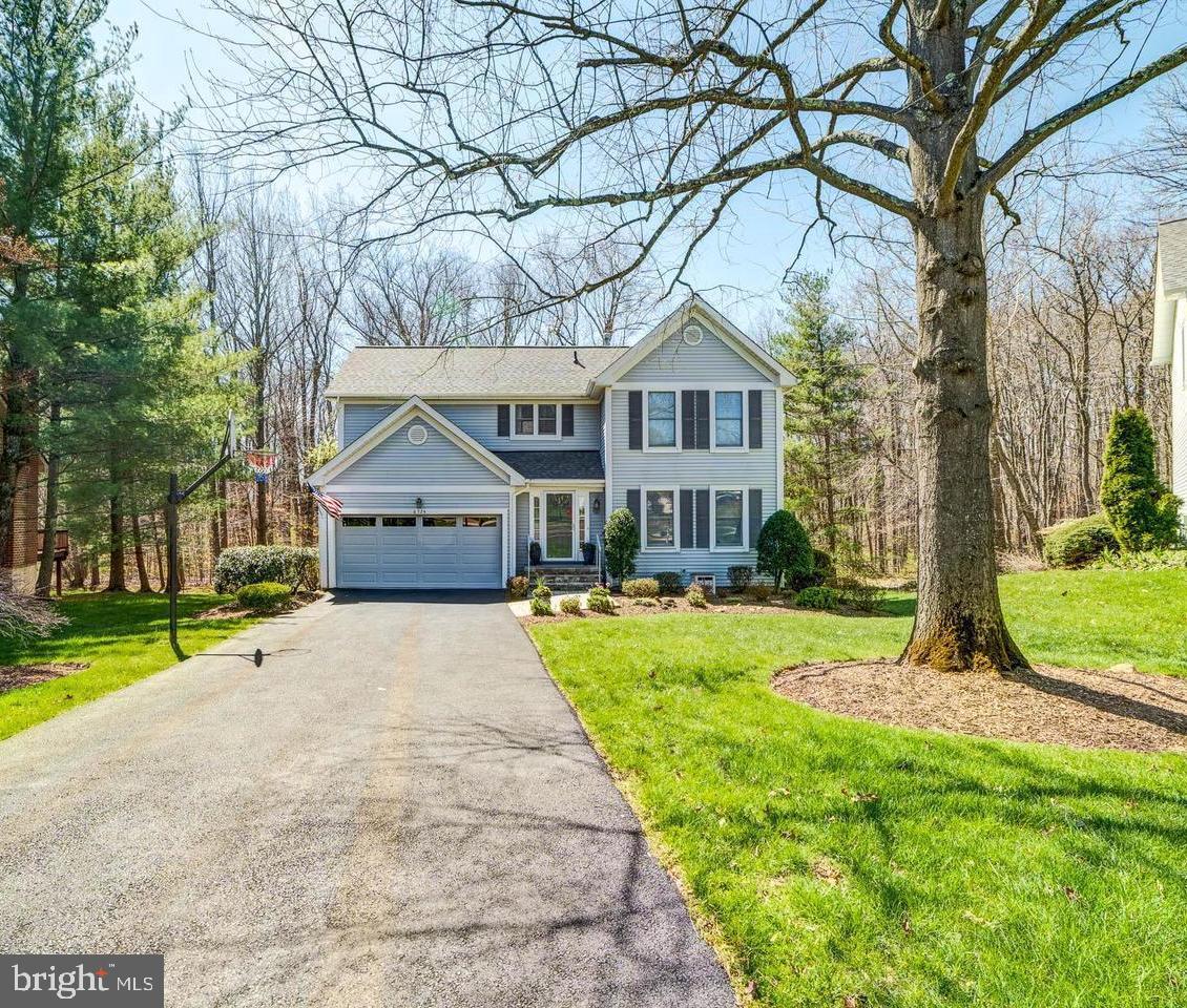 6724 Passageway Place Burke, VA 22015 - Photo 26 of 26 a front view of house with yard and green space