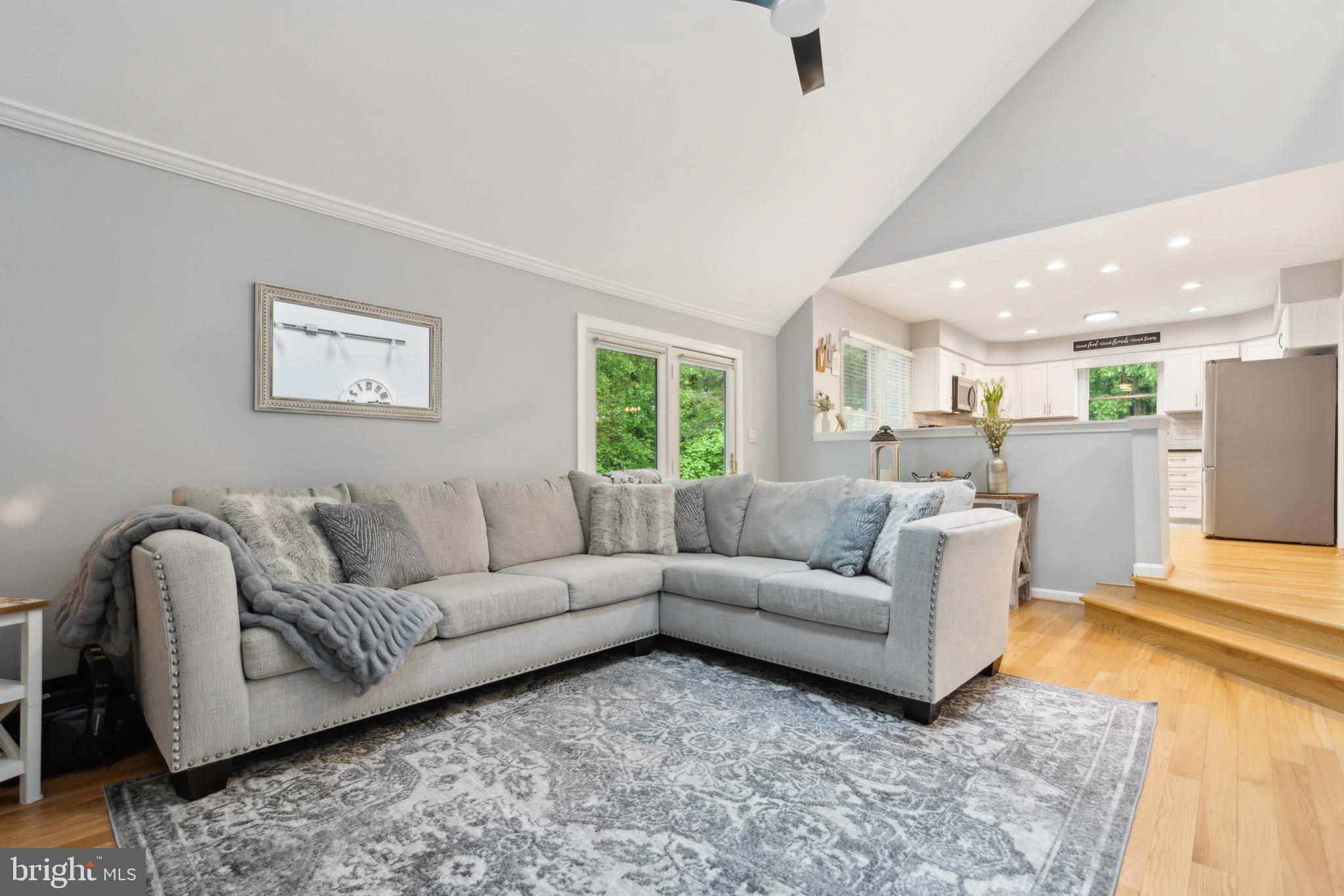 6724 Passageway Place Burke, VA 22015 - Photo 8 of 26 a living room with furniture and a large window