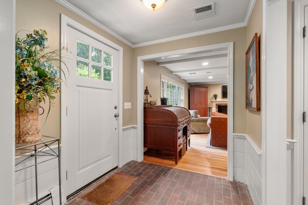 36 Sears Road Wayland, MA 01778 - Photo 4 of 41 a living room with furniture and a potted plant