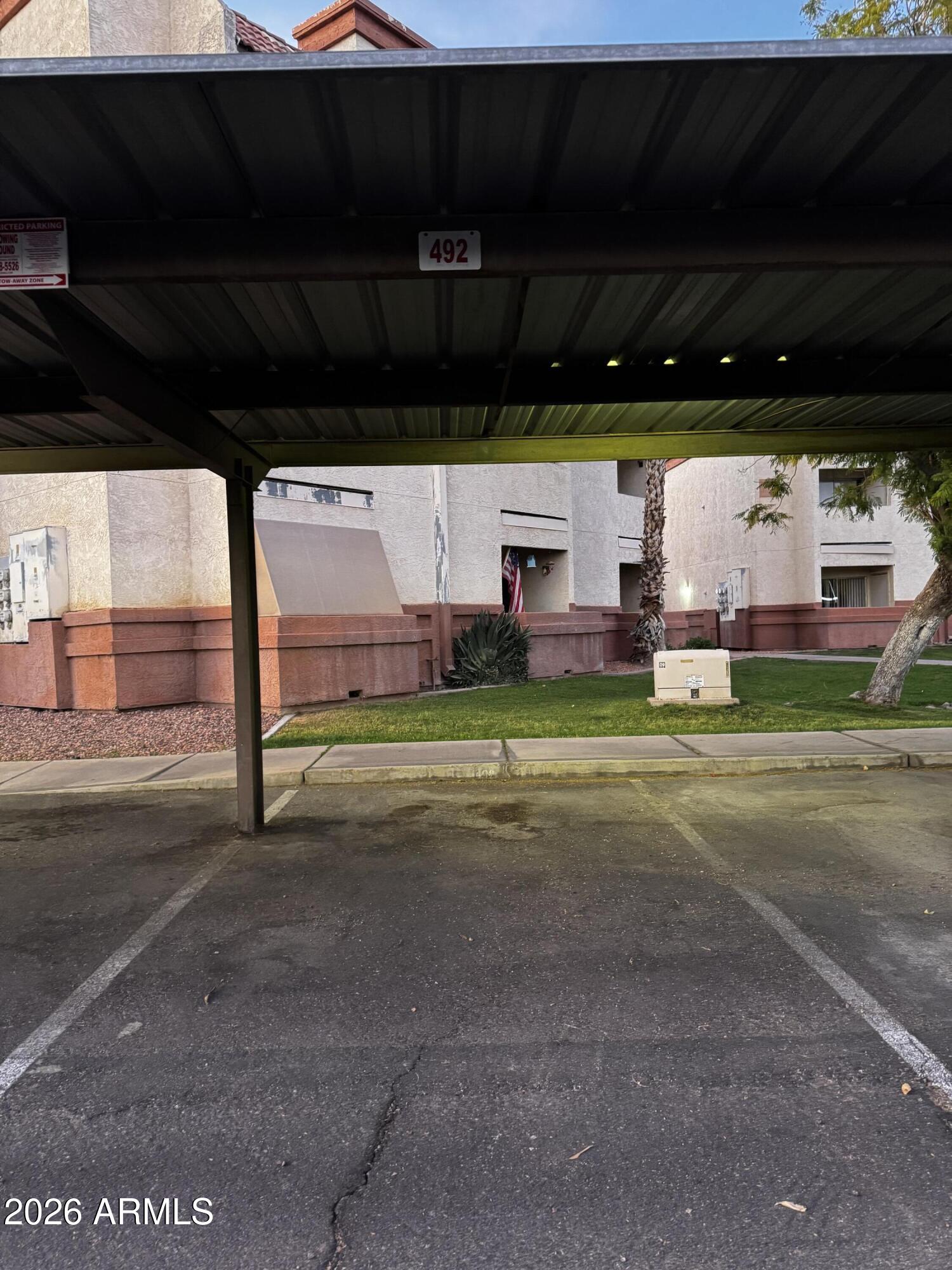 12123 West Bell Road, Unit 258 Surprise, AZ 85378 - Photo 20 of 30 a view of a parking area
