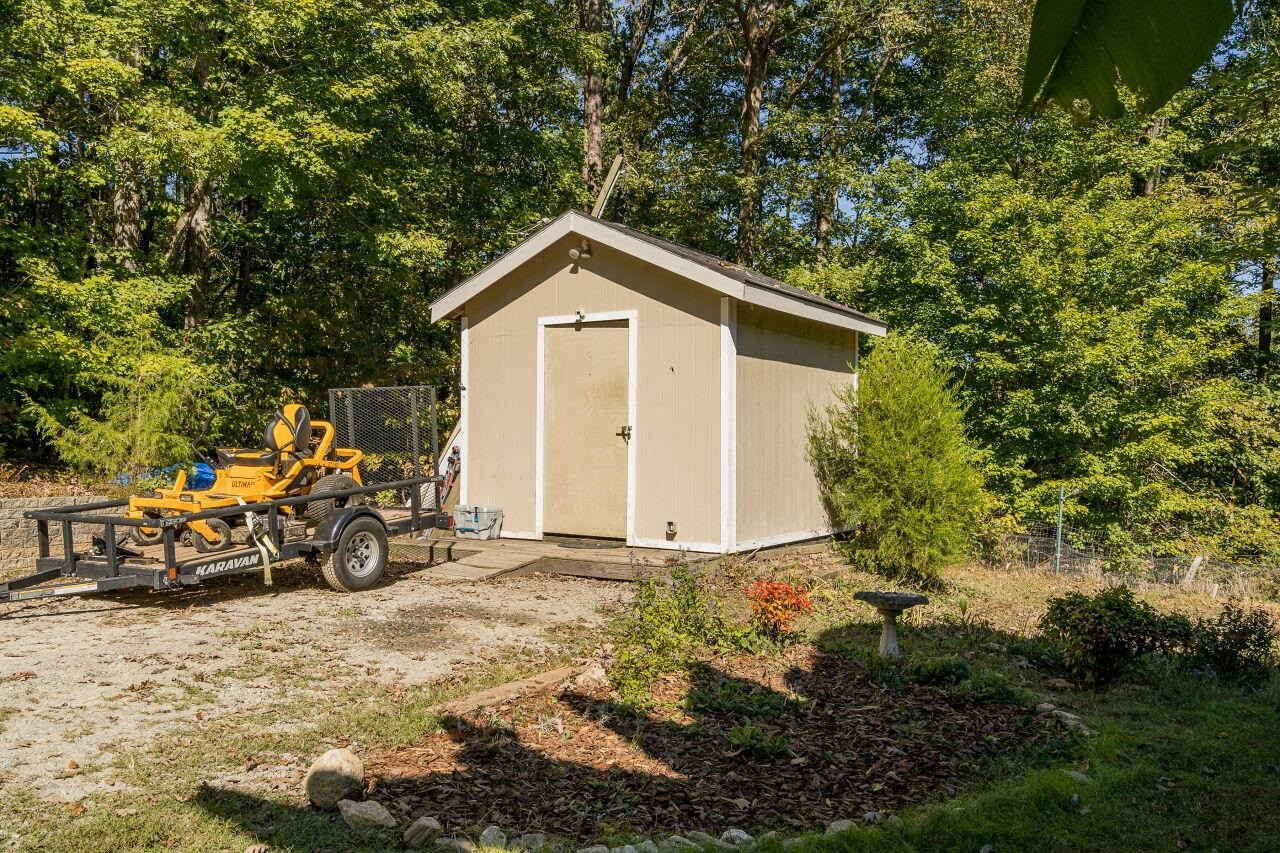 2152 Christian Light Road Fuquay-Varina, NC 27526 - Photo 23 of 30 The exterior storage shed is perfect for storing lawn tools and the like. Storage Shed