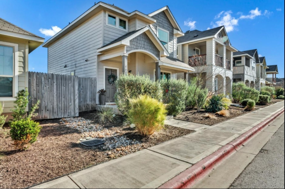 a front view of a house with garden