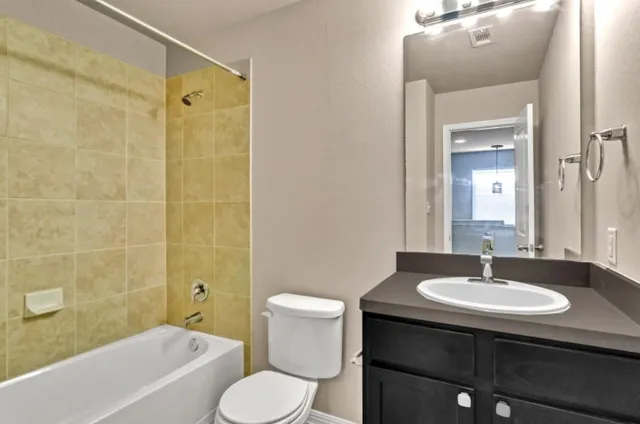 a bathroom with a sink toilet a shower and bathtub