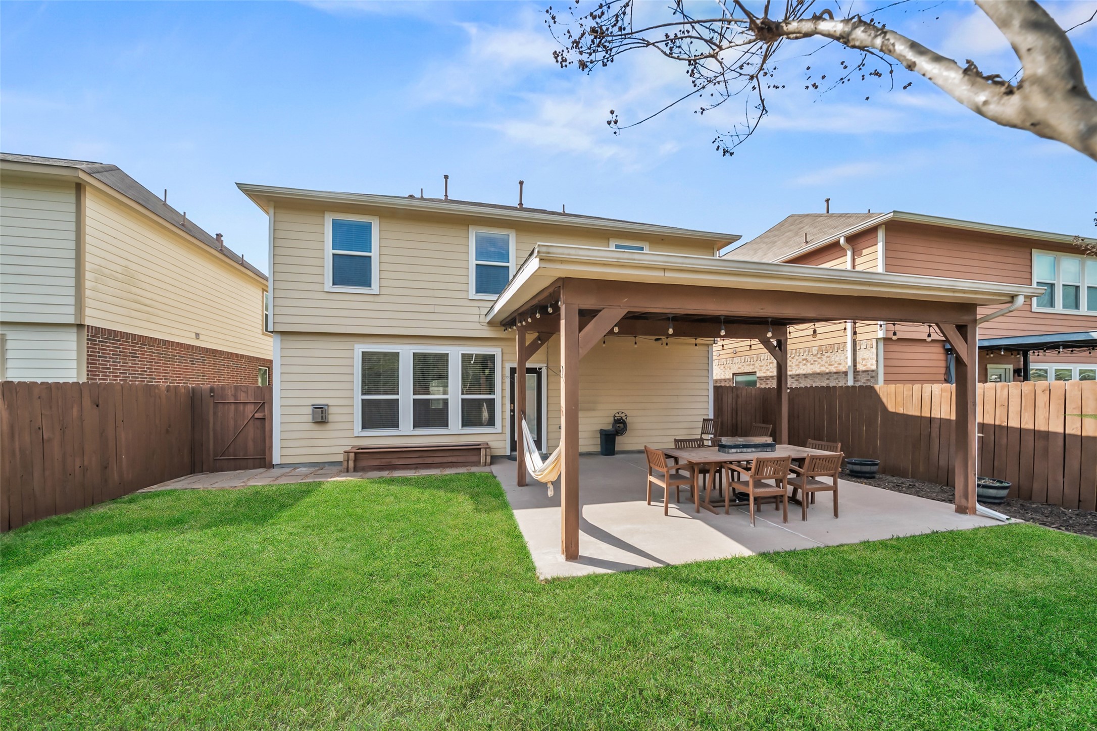 28915 Birch Green Way Spring, TX 77386 - Photo 28 of 30 a view of a patio with table and chairs under an umbrella