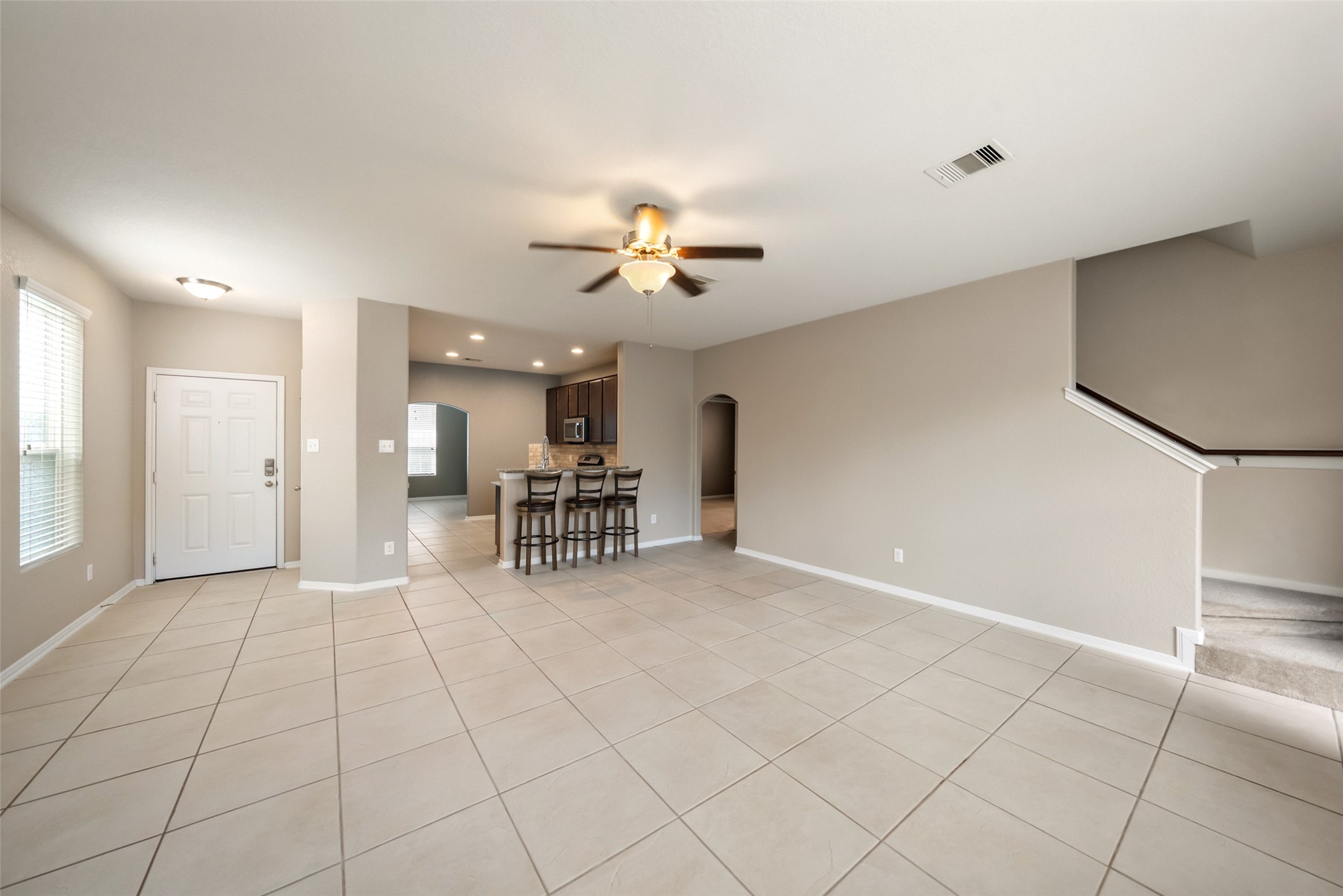 28915 Birch Green Way Spring, TX 77386 - Photo 4 of 30 a view of a livingroom with furniture and a ceiling fan