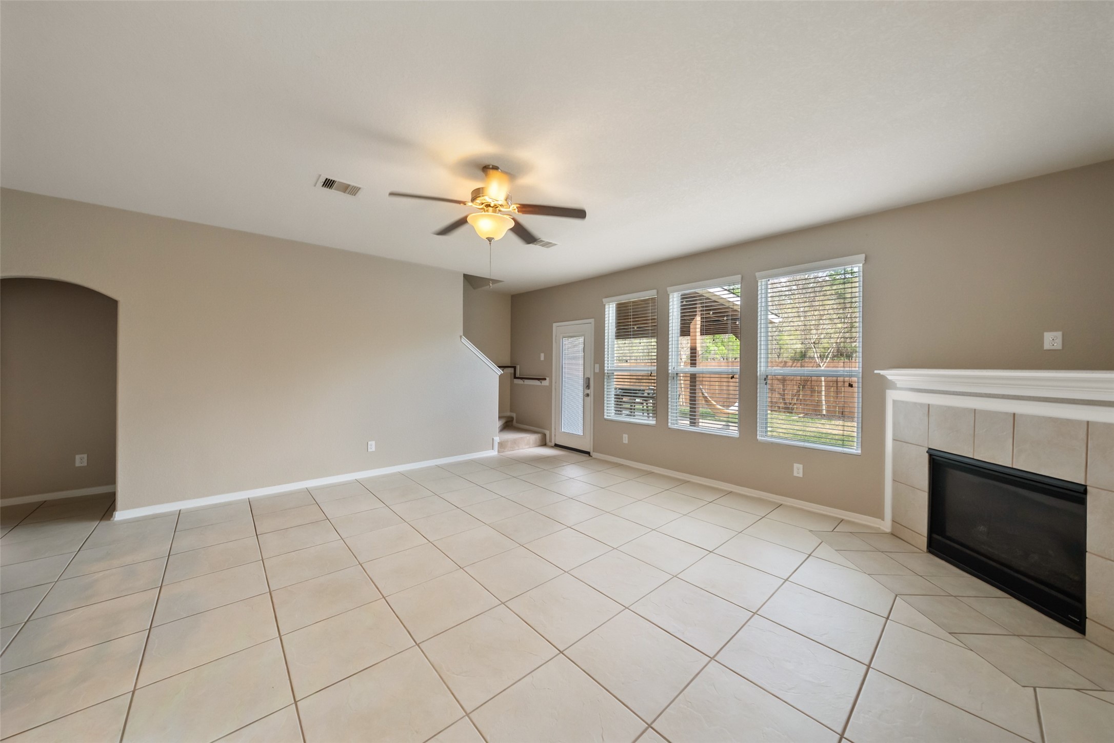 28915 Birch Green Way Spring, TX 77386 - Photo 6 of 30 an empty room with windows and fireplace