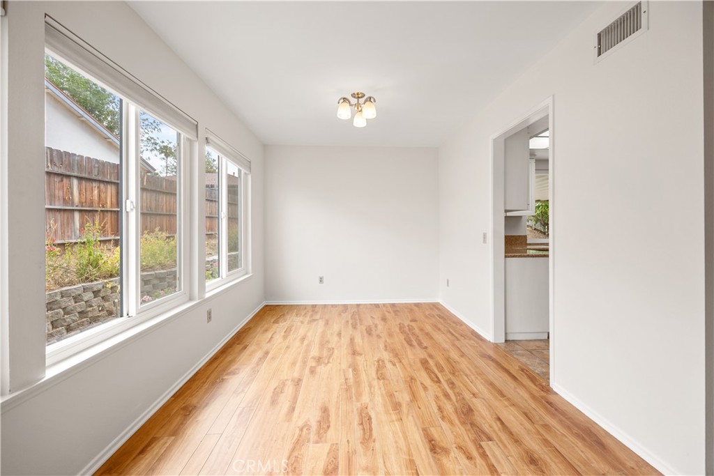 3430 Bahia Place Riverside, CA 92507 - Photo 9 of 34 a view of empty room with wooden floor and fan