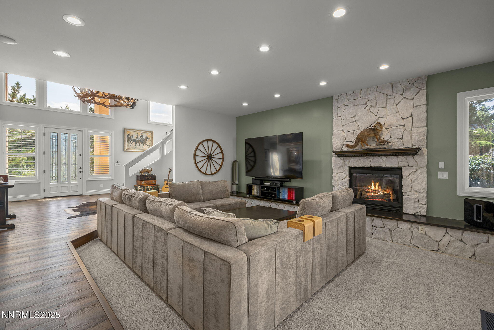 1465 Taos Lane Reno, NV 89511 - Photo 12 of 60 a living room with furniture a fireplace and a flat screen tv