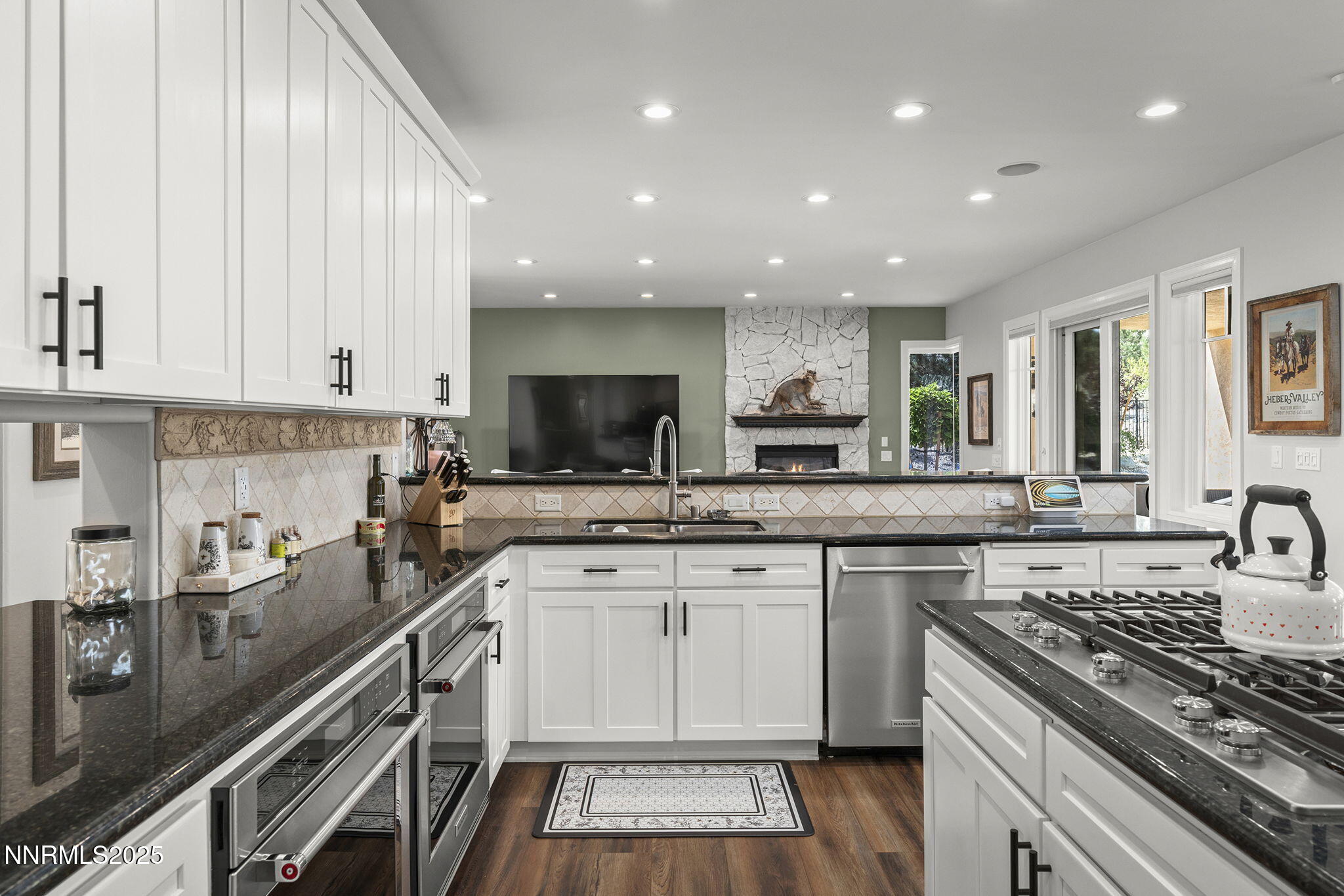 1465 Taos Lane Reno, NV 89511 - Photo 17 of 60 a kitchen with a sink stove and cabinets