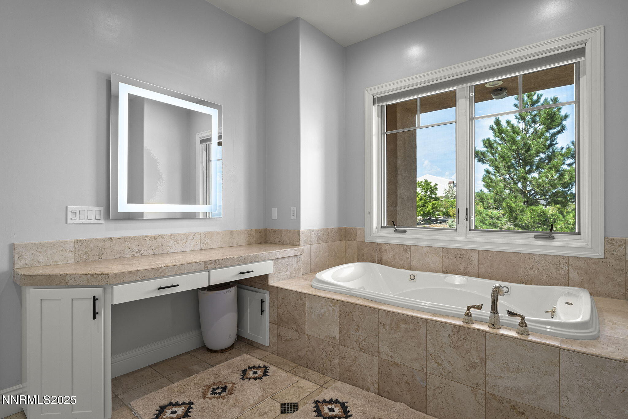 1465 Taos Lane Reno, NV 89511 - Photo 28 of 60 a bathroom with a granite countertop sink and a bathtub next to a window